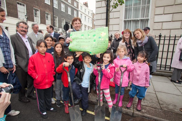 Children from International Community School’s Eco-Team presented a cheque of £300 to Julian Maslinski, Chairman of Westminster Tree Trust at the New Cavendish Street Planting